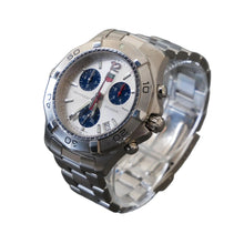 Load image into Gallery viewer, Silver wristwatch with a detailed face on a gray background