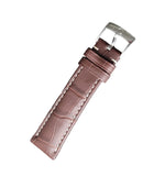 Brown leather watch strap with silver buckle on a gray surface