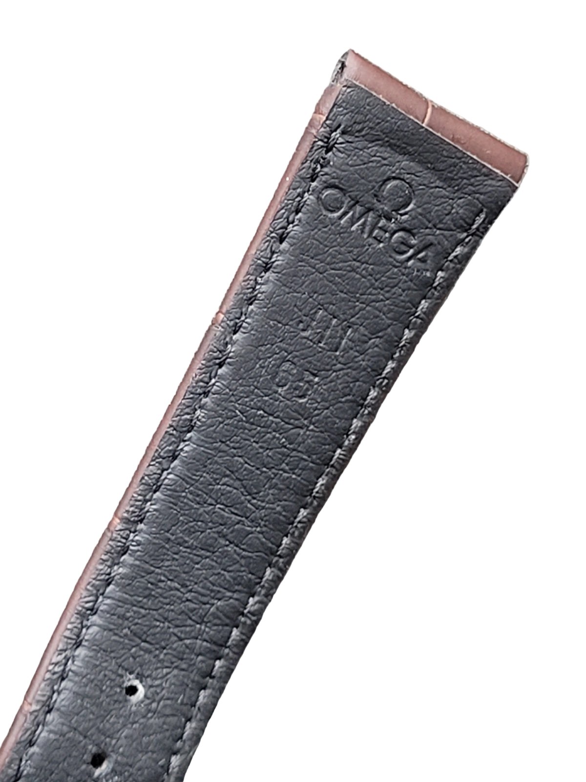 Black leather Omega watch strap on a gray surface