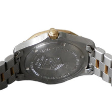 Load image into Gallery viewer, Close-up of a watch with a brand logo on a gray background
