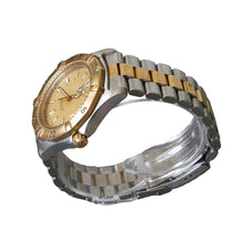 Load image into Gallery viewer, Gold and silver watch on a clear stand against a gray background
