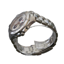 Load image into Gallery viewer, Silver watch on a clear stand with a gray background
