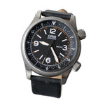 An Oris Automatic watch with a black dial, silver-tone stainless steel case, and a black leather strap, displayed on a clear stand against a textured gray background.