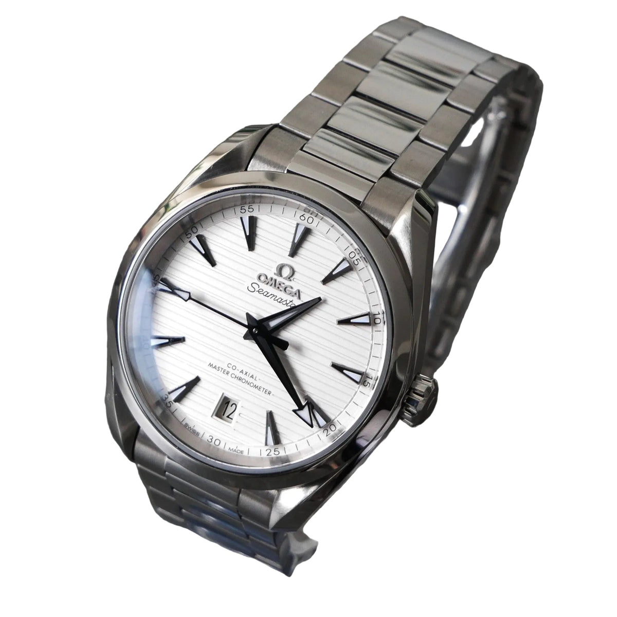 Silver Omega watch on a stand with a dark background