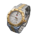 Two-tone silver and gold watch on a gray background
