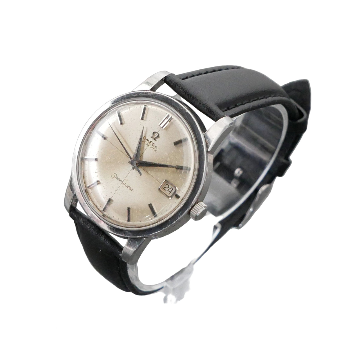 Vintage wristwatch with black strap on a gray background