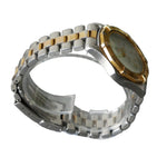 Two-tone silver and gold watch on a gray background