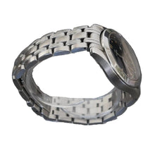 Load image into Gallery viewer, Silver watch on a clear stand against a gray background
