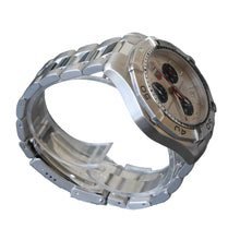 Load image into Gallery viewer, Silver watch on a clear stand against a gray background
